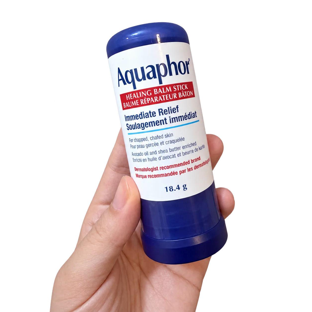 A hand holding Aquaphor Healing Balm Stick, 18.4 g.