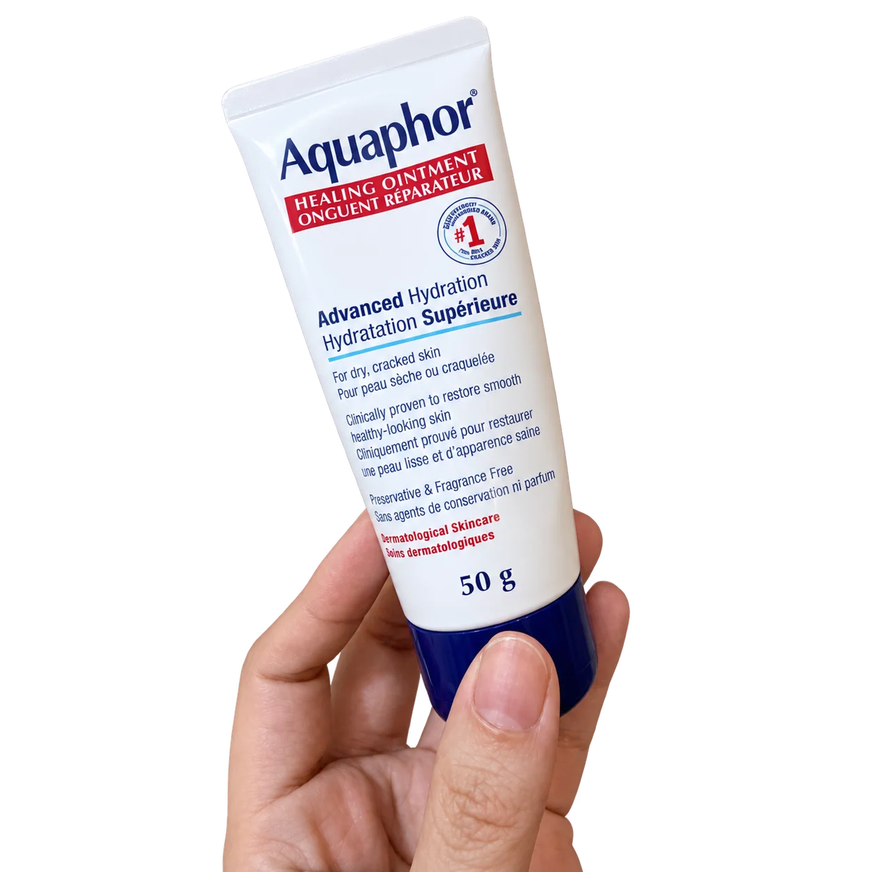 A hand holding Aquaphor Healing Ointment, 50 g.