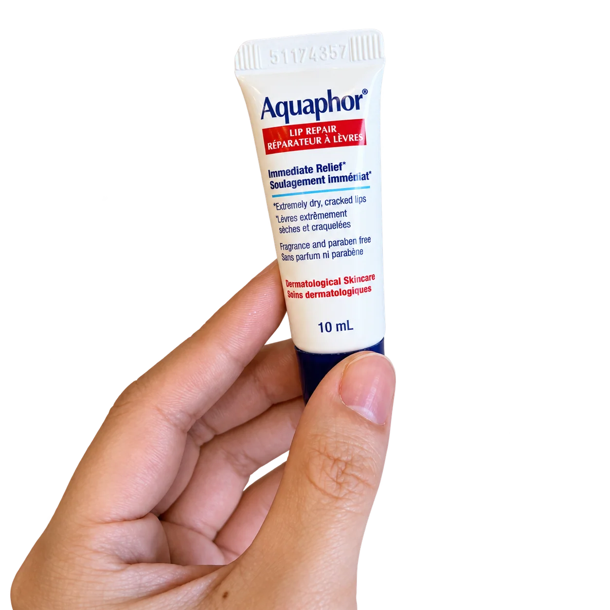 A hand holding Aquaphor Lip Repair, 10 mL.