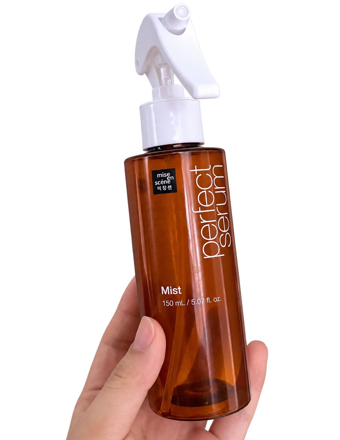 My hand holding a 150 mL trigger-spray bottle of mise en scène Perfect Serum Mist.